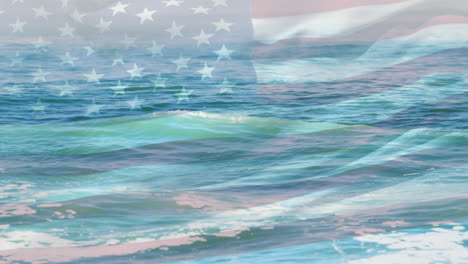 Animation-of-flag-of-united-states-blowing-over-beach-seascape