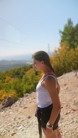 young woman enjoying a scenic mountain view