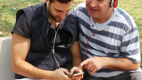 father and son listening music and having fun