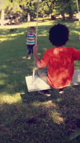 happy little boy on a swing