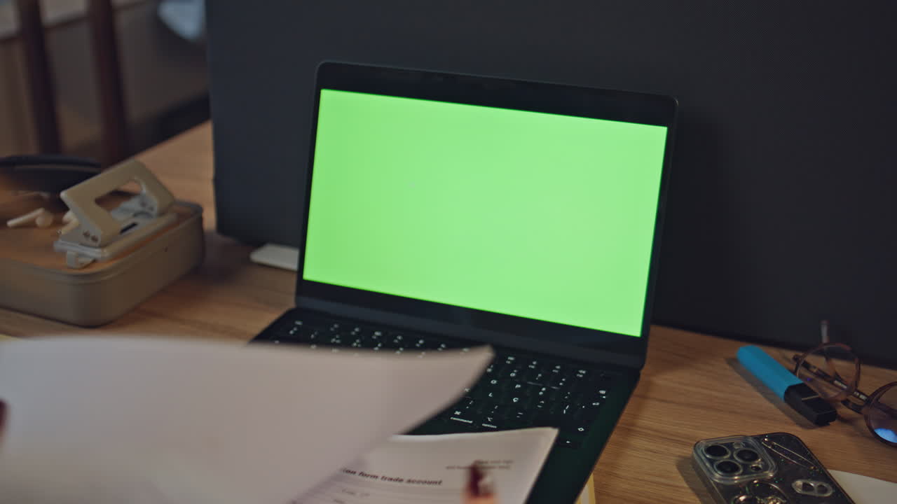 Accountant hands working chromakey laptop at evening office workplace closeup