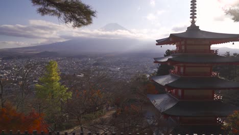 Wide-tilt-up-over-Chureito-Pagoda-grounds-and-Mt-Fuji-on-clear-sunny-day-in-slow-motion