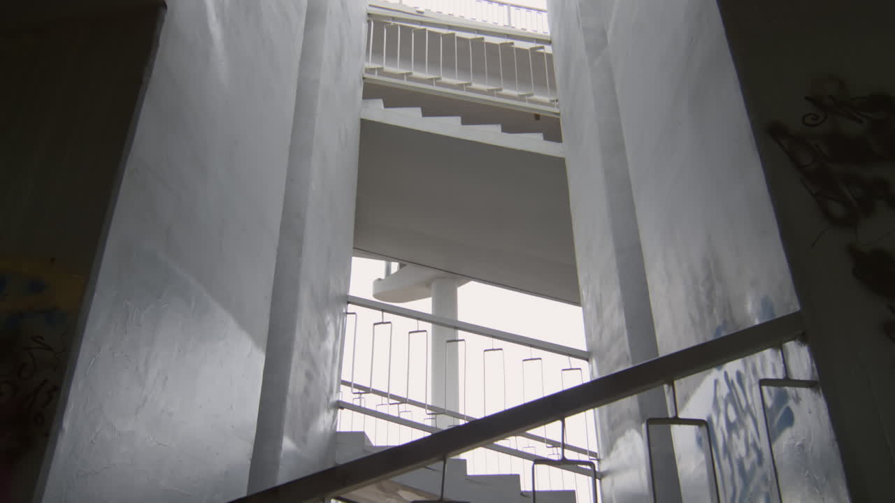 Athlete Running Down Urban Stairs