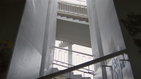 athlete running down urban stairs