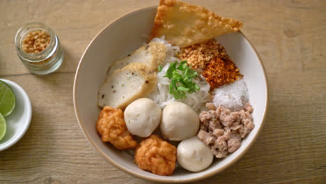 spicy small flat rice noodles with fish balls and shrimp balls without soup - asian food style