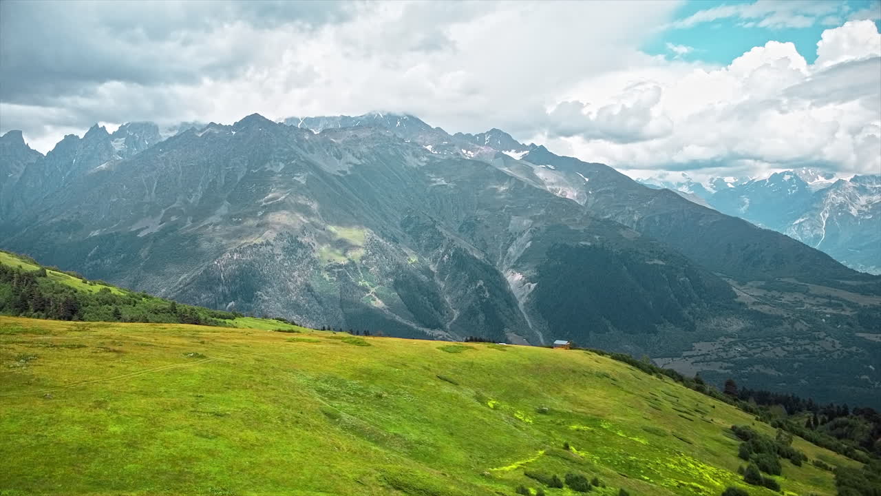Aerial drone view of nature in Georgia. Caucasus Mountains, greenery, valleys, lush clouds