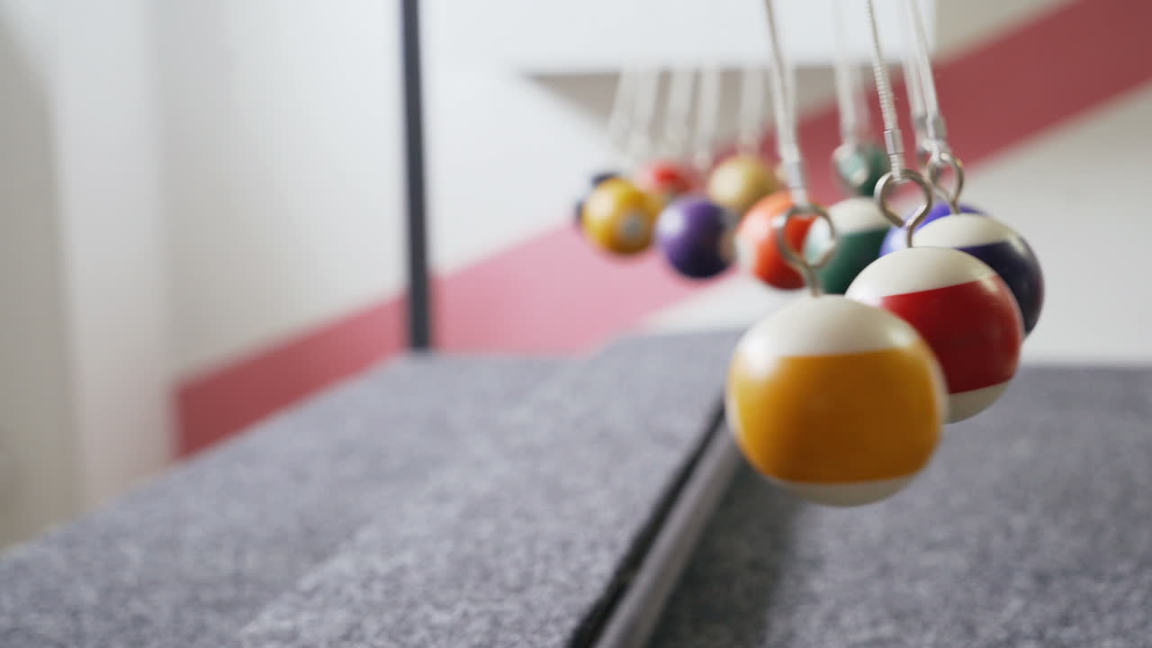 Balancing balls of Newton's cradle. Museum of Science