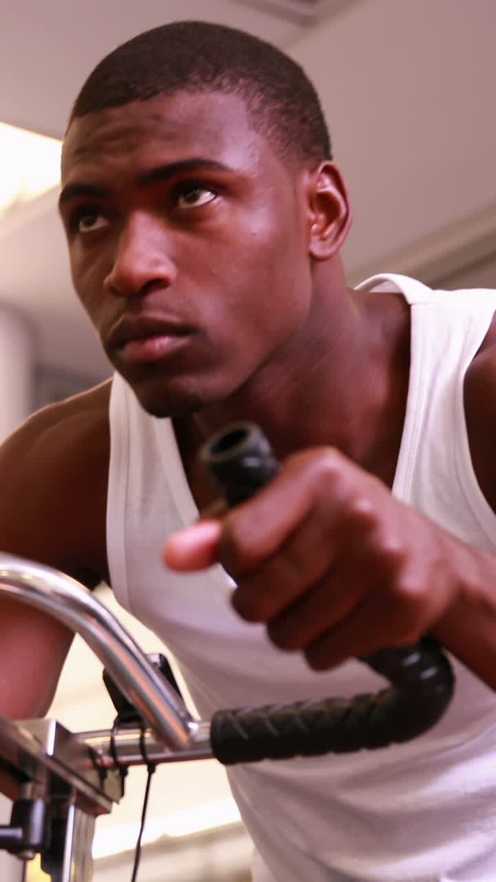 Fit man working out on the exercise bike
