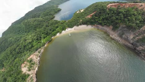 a 360 drone shot of a boat in chacachacare island located off the north west coast of trinidad and tobago