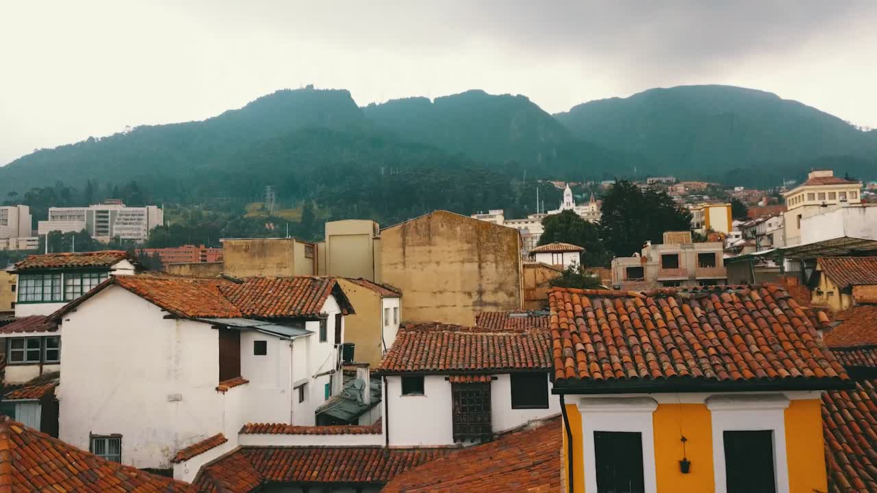 Aerial view of one of the streets of the centre of Bogot&aacute;, Colombia, with colonial houses and mount Monserrate in the background