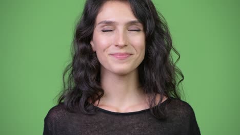 face of happy young beautiful woman relaxing with eyes closed