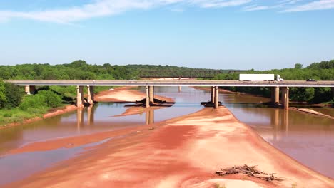 aerial footage flying over the red river on the texas and oklahoma border