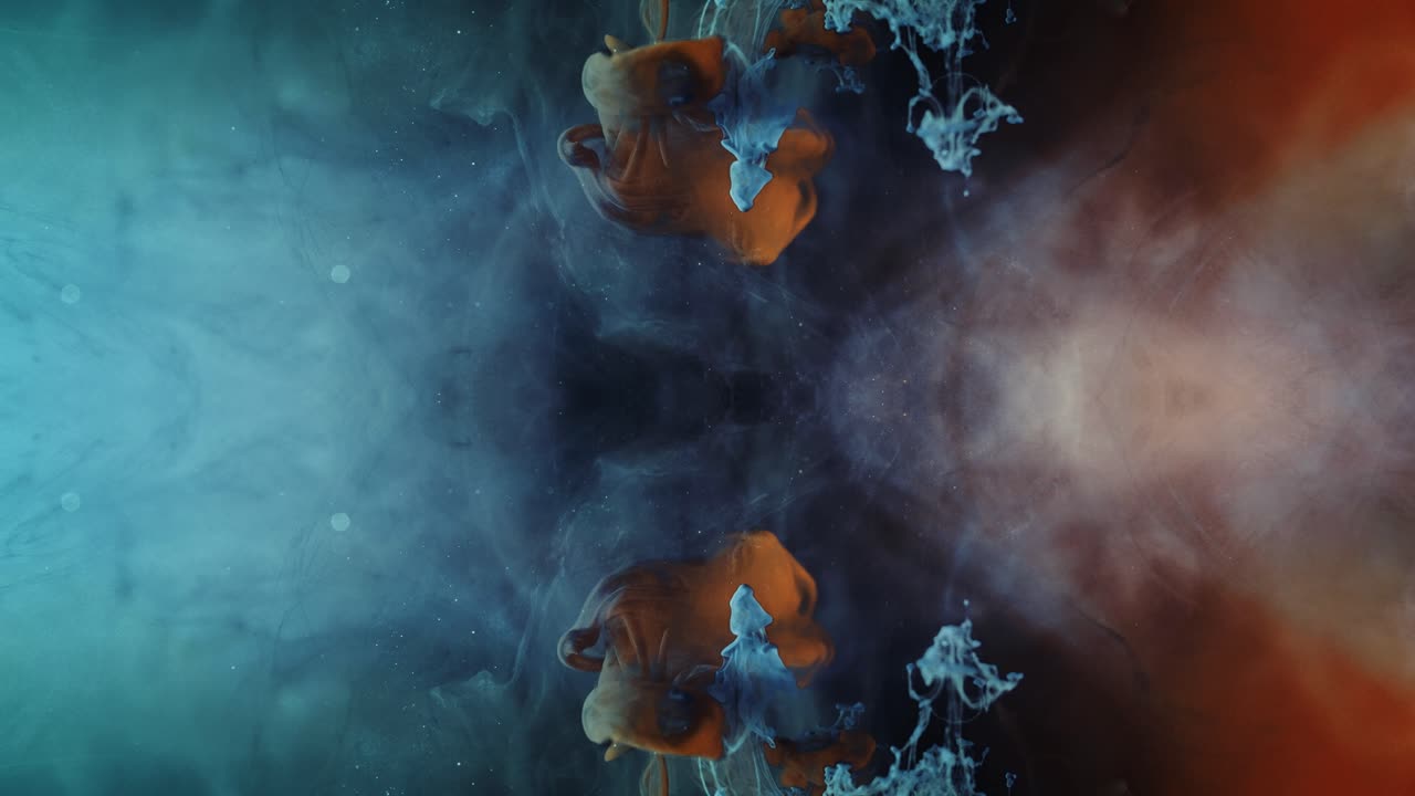 Mixing Dark Brown With Blue Ink Colors In Water With Abstract Background