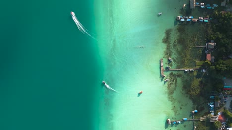 aerial view of bacalar lagoon coastline with hotel and resorts along the shoreline, quintana roo, mexico