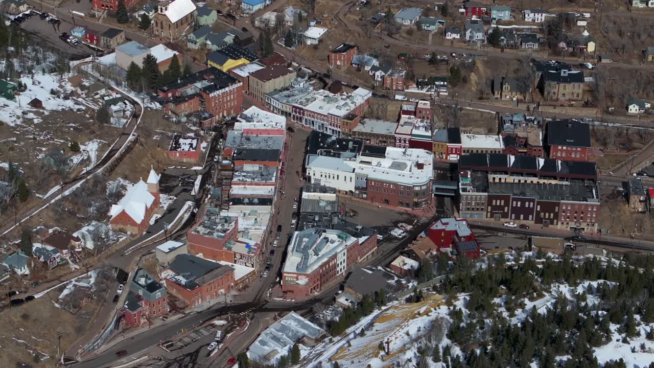 Snowy Downtown Central City Black Hawk Colorado Birds Eye view aerial drone view city historic buildings town hall winter sunny daytime blue sky Gold mining town streets casinos cars static shot