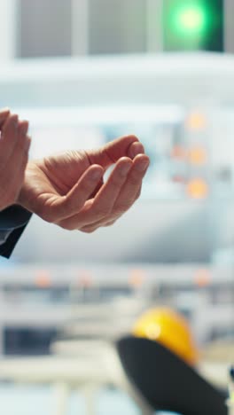 vertical video businessmen in photovoltaics factory closing deal, shaking hands