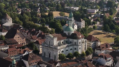 drone shot of st. ursus cathedral and historic old town in solothurn, switzerland, on sunny summer day