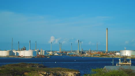 the peaceful oil refinery in isla, curacao - wide pan shot