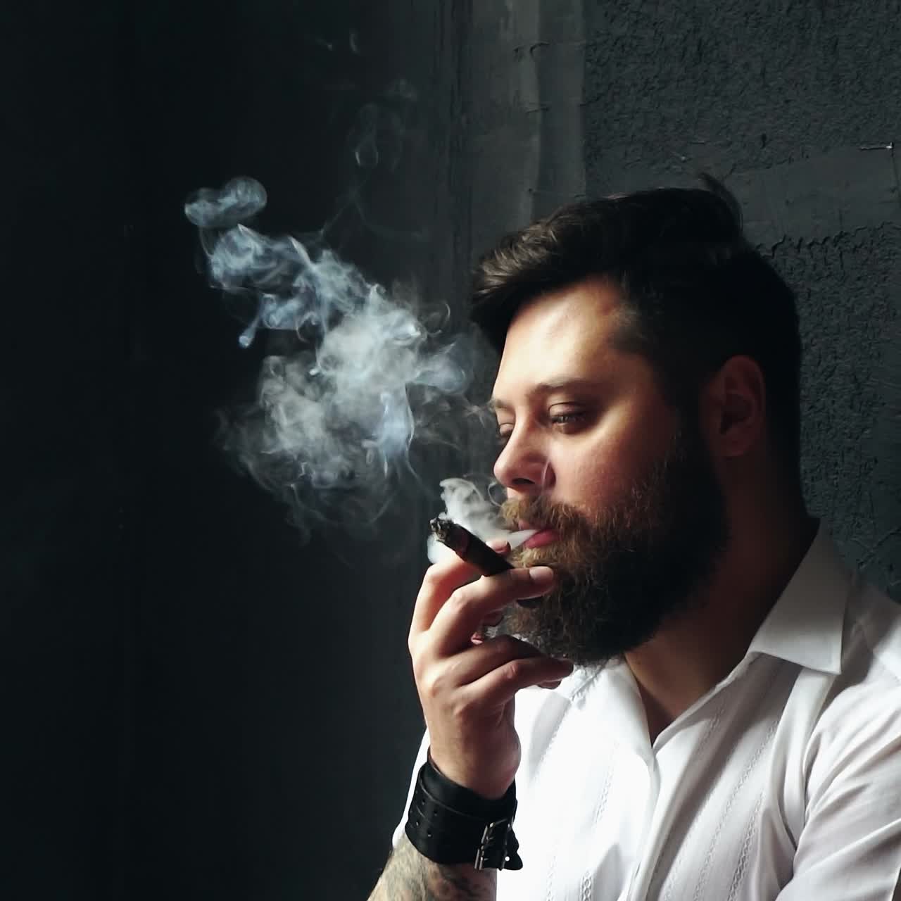 Brutal handsome man with ciga