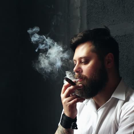 brutal handsome man with ciga