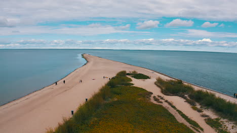 aerial view of drone flying towards the cross in the beach, headland in rewa, poland