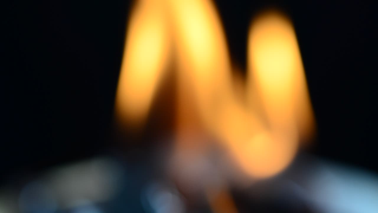 The burning fabric, out of focus. Shooting of the burning fabric