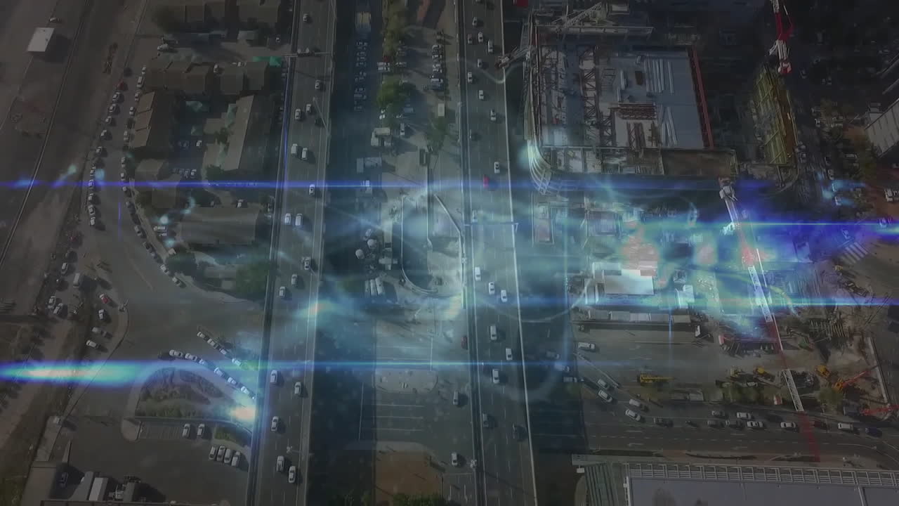 Multi-lane intersection showing digital overlay in 3D render with cars cruising and cranes lifting