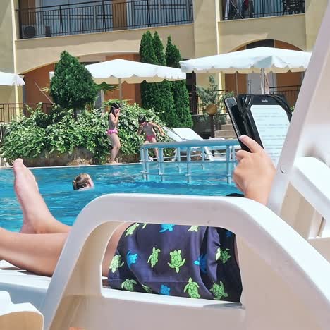 happy young boy by the pool.
