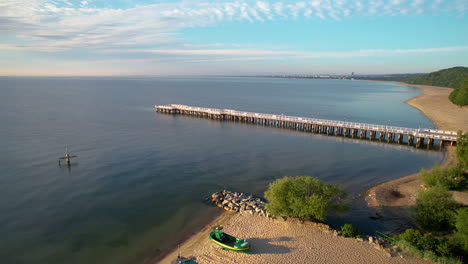 Sunrise-aerial-view-of-iconic-Gdynia-Orlowo-pier-in-bay-of-Gdansk,-Poland