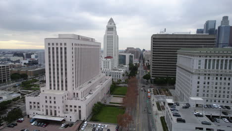 drone shot of los angeles city hall, spring street courthouse la superior court, hall of justice and downtown traffic