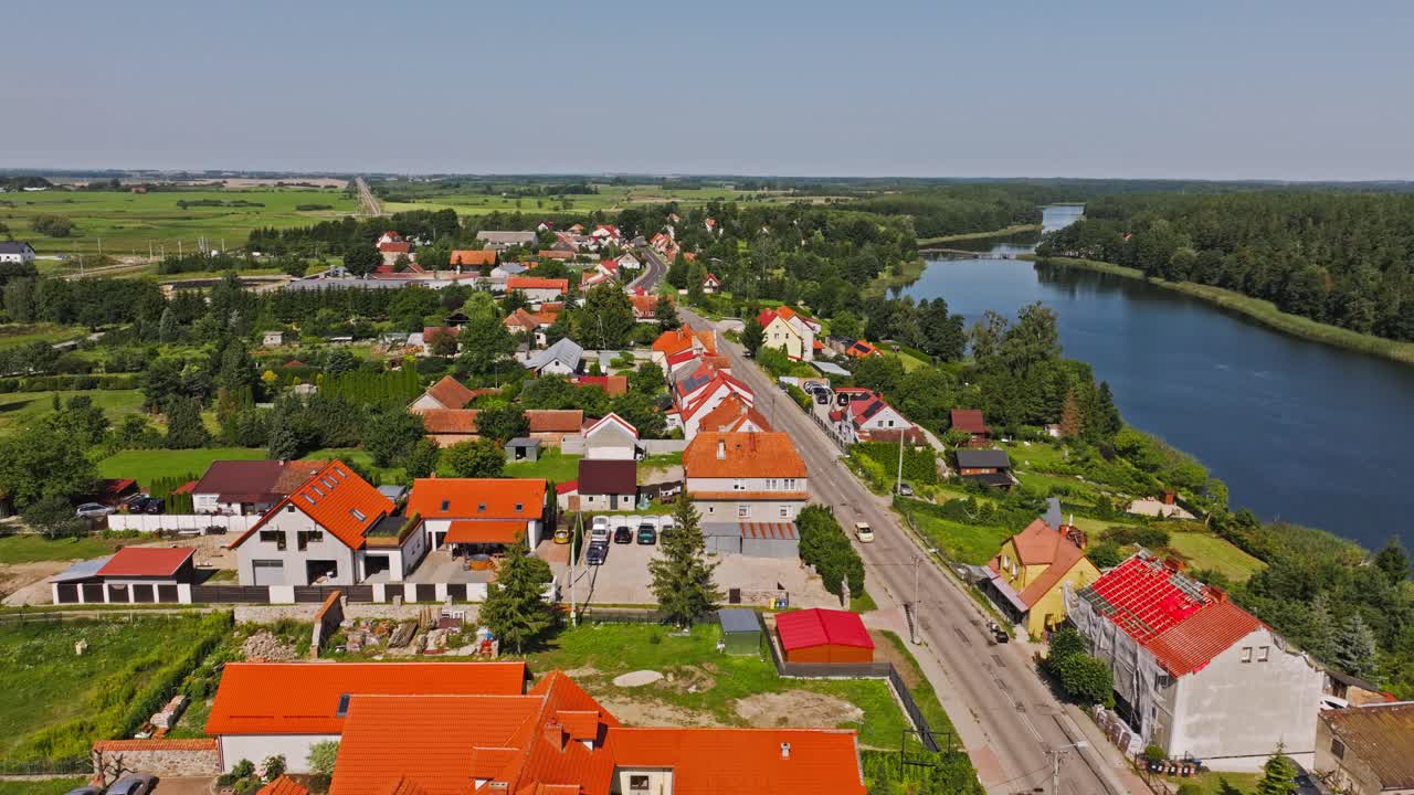Peaceful lakeside town of Wydminy seen from drone on bright summer morning