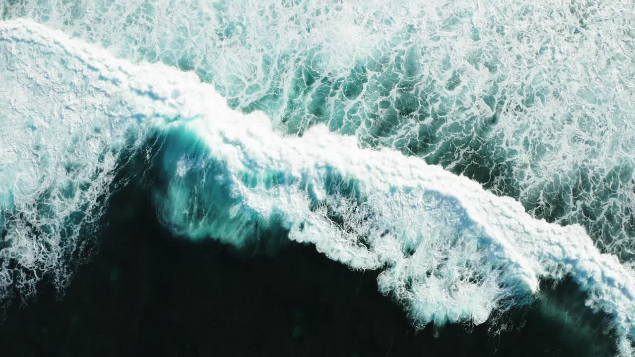 Aerial top down view of breaking waves