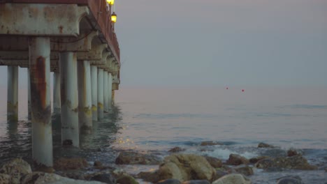 Wooden-pier-in-Marbella,-Spain,-at-evening