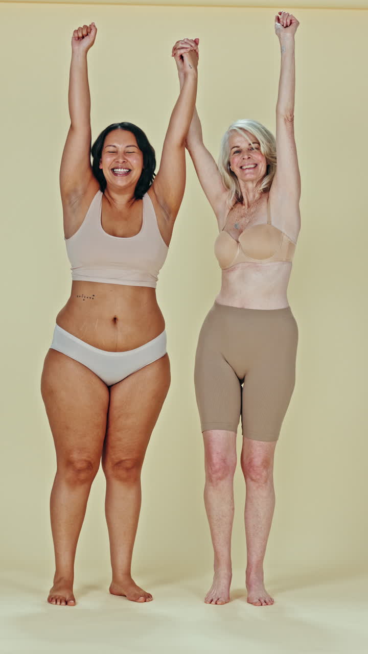 Two diverse women celebrating body positivity
