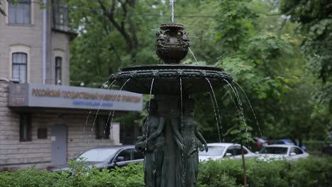 city fountain in the rain