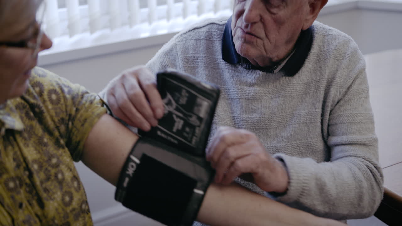 Seniors Checking Blood Pressure