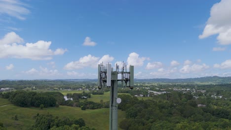 cell tower amidst rolling hills and clouds