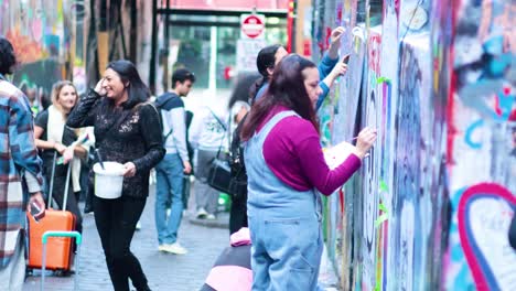 artists and visitors engage in vibrant street art