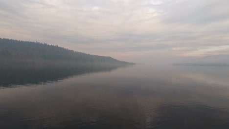 misty scene over lake windermere in the english lake district national park