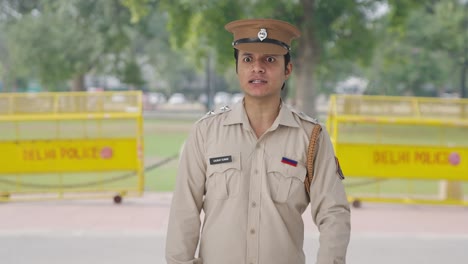 angry indian police officer shouting on someone