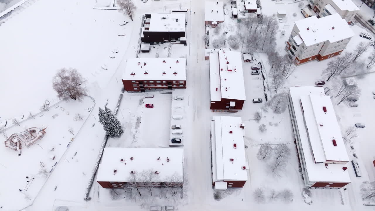 Aerial View of a Snow Covered Residential Area in Winter