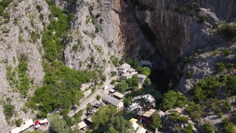 aerial overhead view of blagaj tekija, a cliffside monastery in bosnia and herzegovina