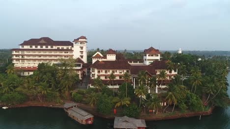 Fly-away-drone-footage-of-a-hotel-in-the-lake