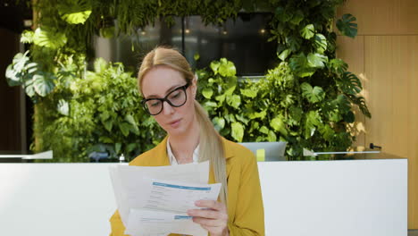 blonde receptionist working in a hotel