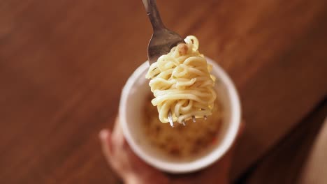 instant noodles on a fork