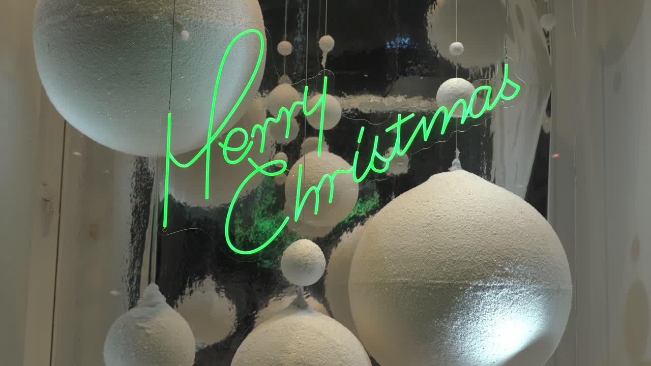 un primer plano de un letrero de navidad iluminado