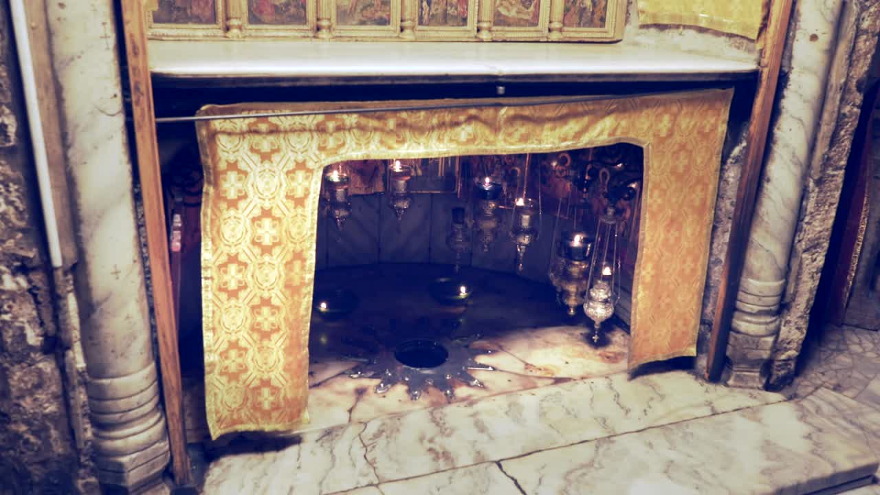 zoom in on the fourteen point star in the church of the nativity in bethlehem