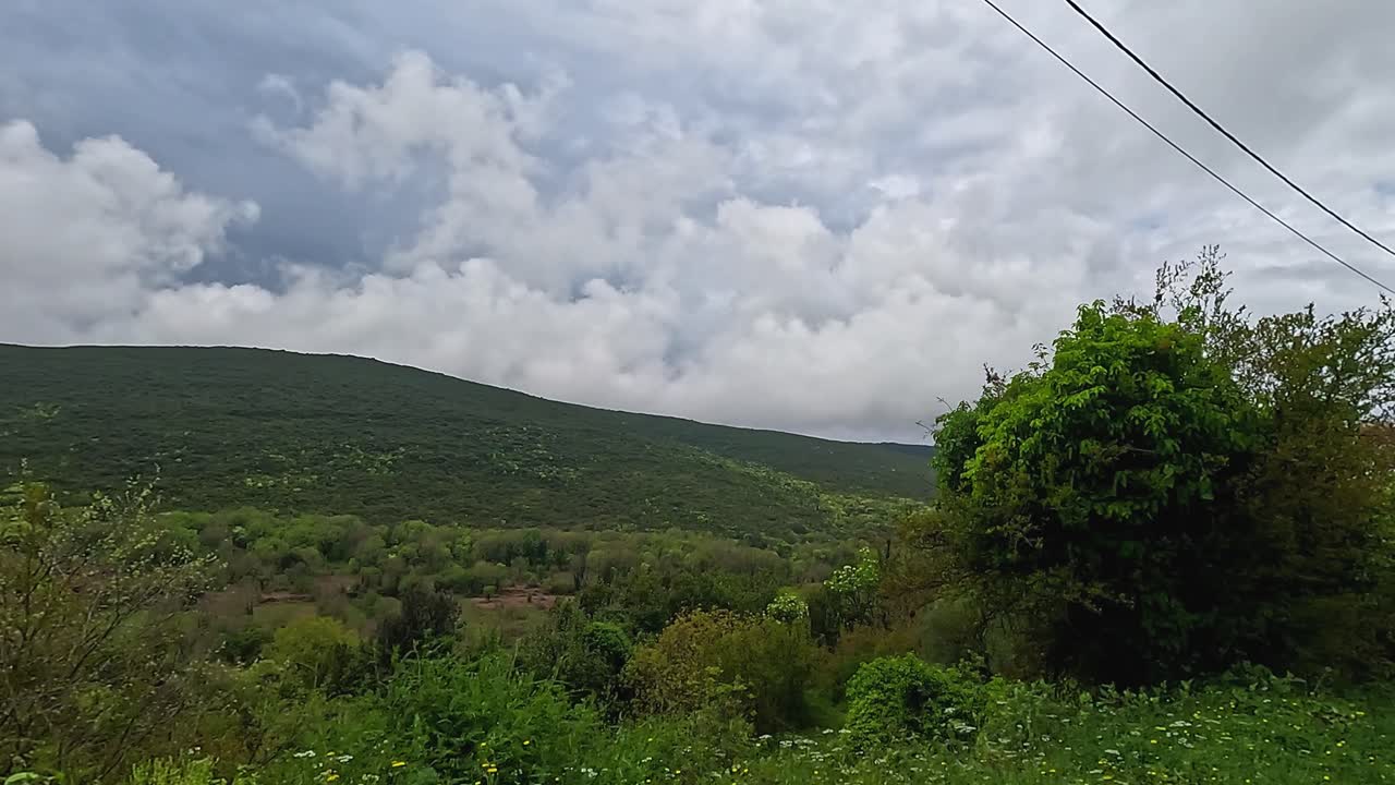 Driving the Serpentine Pass Overlooking Kotor Bay Montenegro Through Fog and Lush Forests