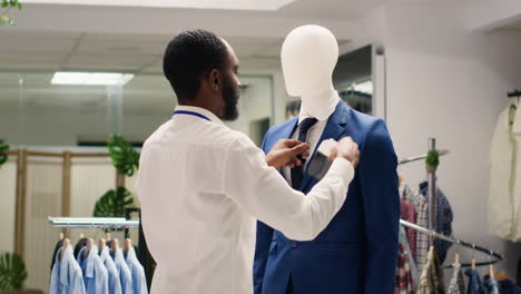 Employee-adding-pocket-square-to-blazer