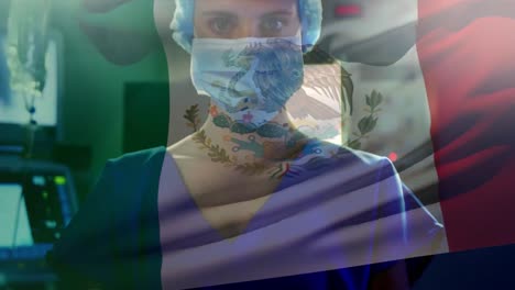 Animation-of-flag-of-mexico-waving-over-anesthesiologist-in-operating-theatre